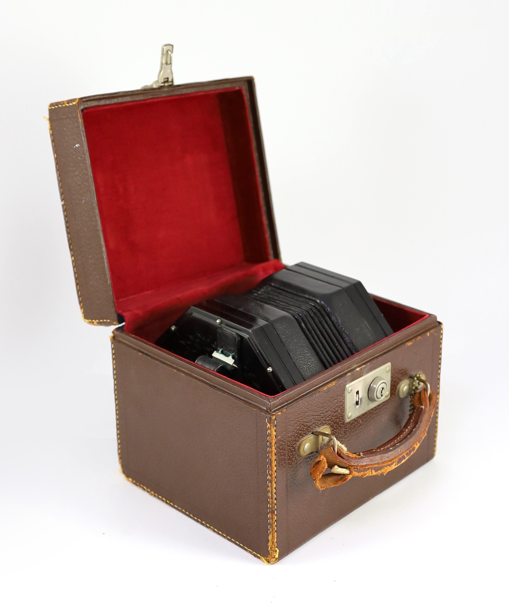 PLEASE NOTE 57 KEYS. A Wheatstone 'English' Model No. 5E 57 key concertina, diameter 17cm, with original leather case